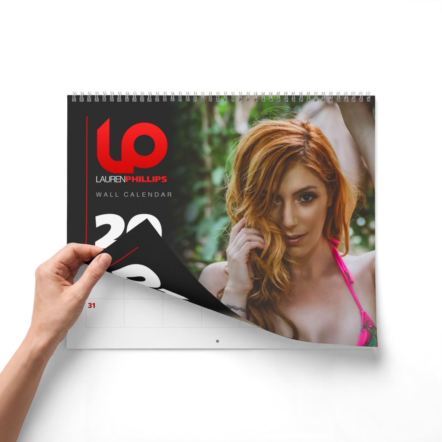 Turning the cover of the Lauren Phillips 2027 wall calendar